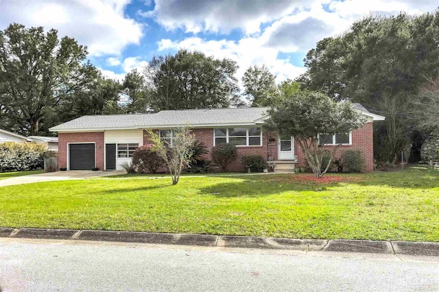 ranch-style house with driveway, brick siding, an attached garage, and a front yard