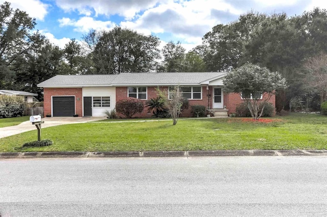 ranch-style house featuring concrete driveway, an attached garage, brick siding, and a front yard