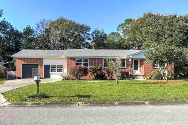 ranch-style house with brick siding, a front lawn, concrete driveway, crawl space, and an attached garage