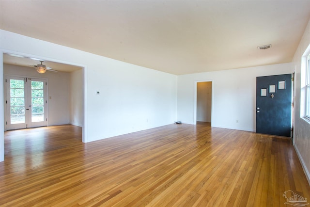 interior space featuring visible vents, french doors, and light wood-style floors