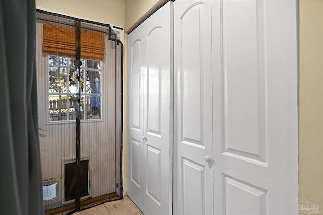 interior space with light tile patterned flooring