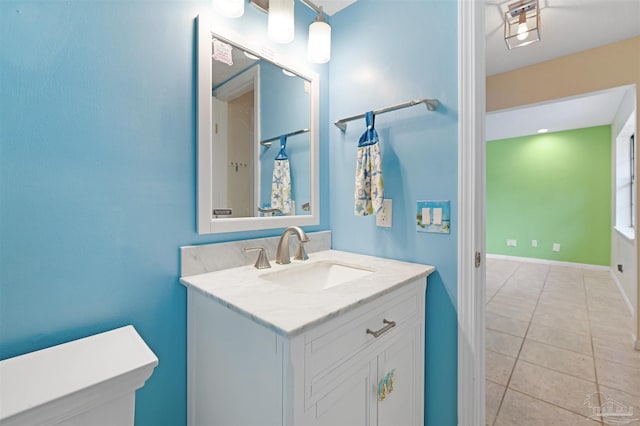 full bathroom featuring tile patterned flooring and vanity