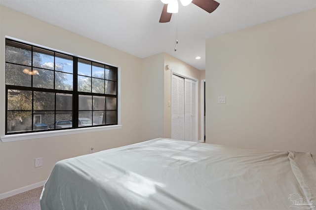 bedroom featuring a closet, ceiling fan, baseboards, carpet flooring, and recessed lighting