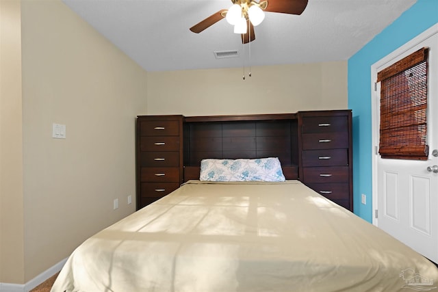 bedroom with visible vents, baseboards, and ceiling fan