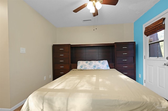 bedroom with ceiling fan, baseboards, and visible vents