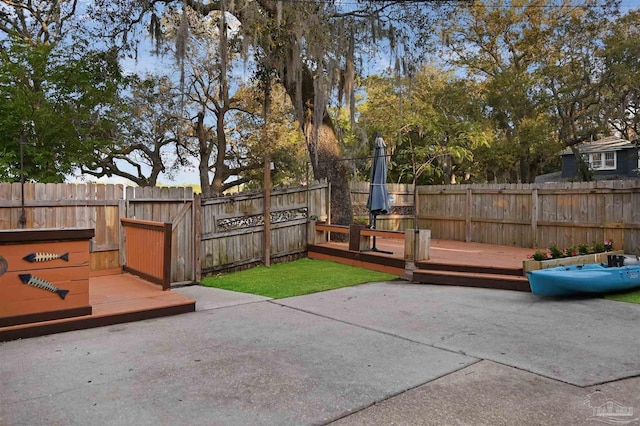 view of patio / terrace featuring a fenced backyard and a deck