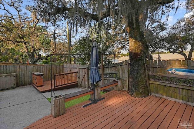 deck featuring a fenced backyard