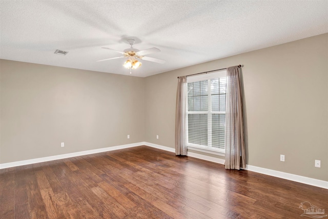 unfurnished room with ceiling fan, hardwood / wood-style flooring, and a healthy amount of sunlight