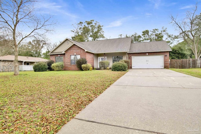 ranch-style house featuring a garage and a front lawn