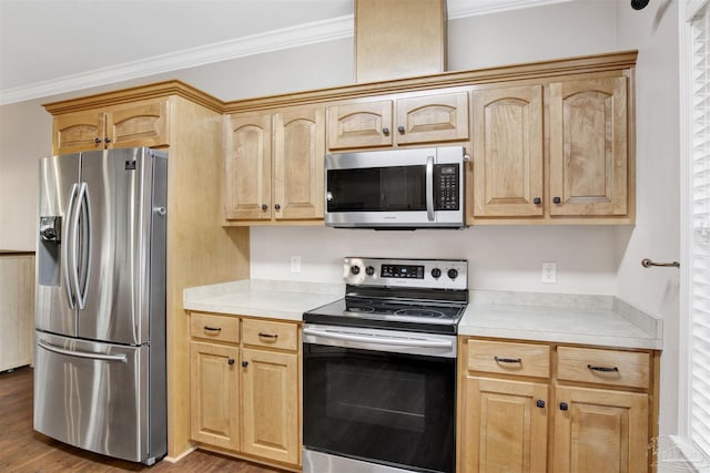 kitchen featuring crown molding, wood-type flooring, light brown cabinets, and appliances with stainless steel finishes