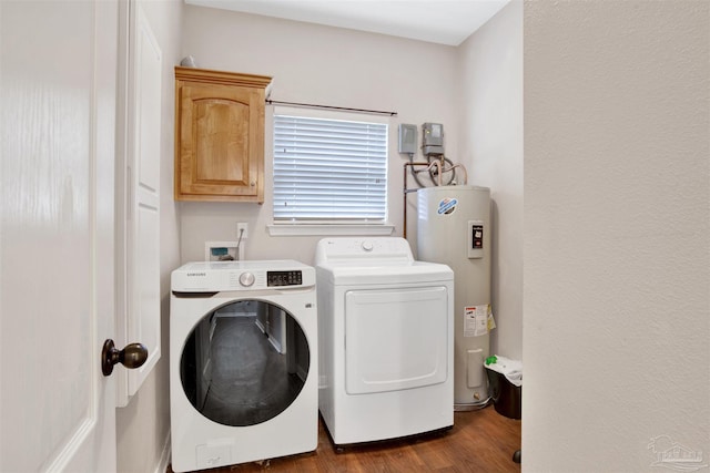 washroom featuring cabinets, dark hardwood / wood-style floors, washing machine and dryer, and water heater