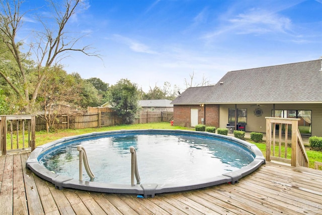 view of swimming pool featuring a deck