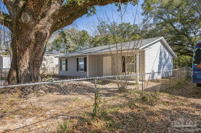 ranch-style home featuring a fenced front yard