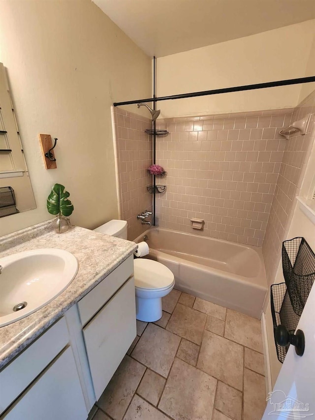 full bathroom featuring vanity, toilet, and tiled shower / bath combo