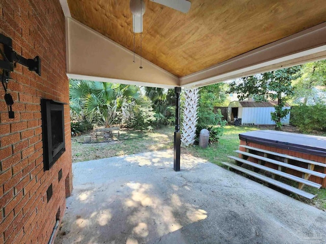 view of patio / terrace featuring a storage shed