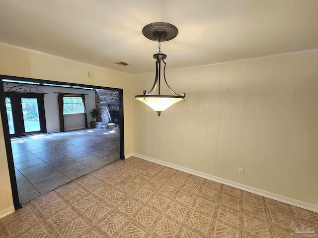 unfurnished dining area featuring tile patterned flooring