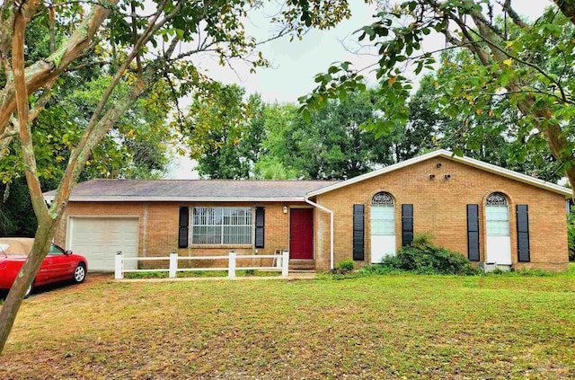 ranch-style house with a front lawn and a garage