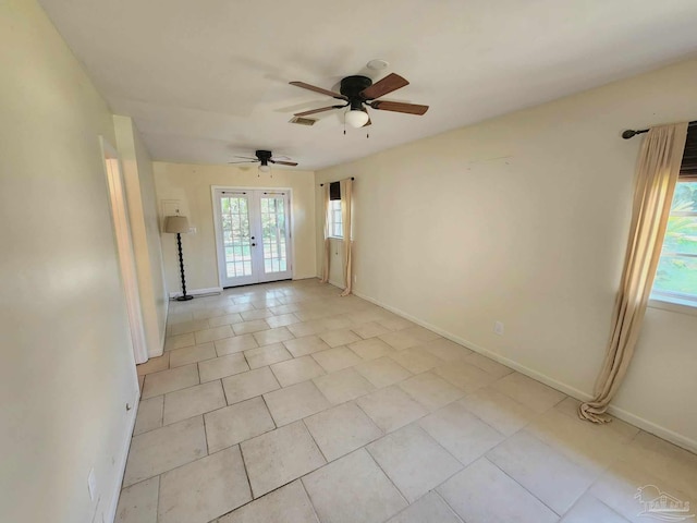 tiled empty room with french doors and ceiling fan