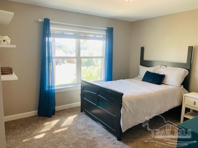 bedroom featuring light colored carpet