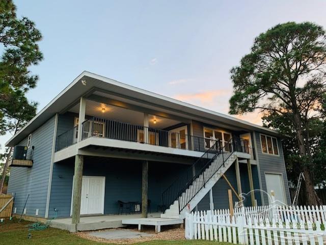 view of back house at dusk