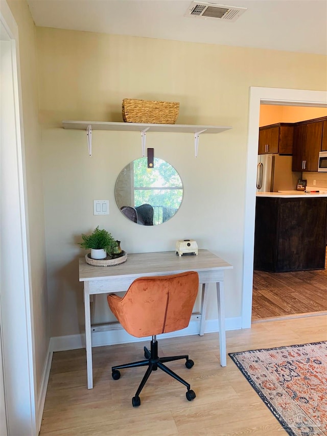 office space featuring light wood-type flooring