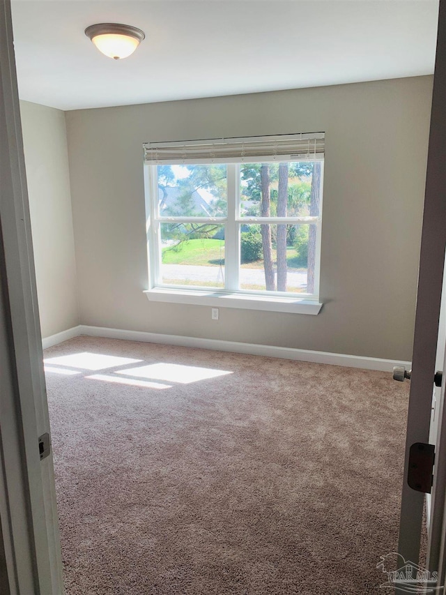 view of carpeted spare room