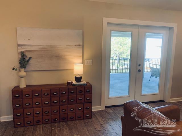 entryway with dark hardwood / wood-style flooring and french doors