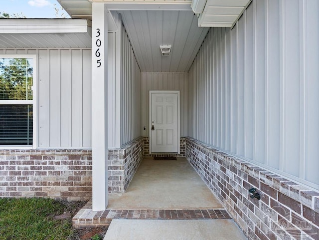 entrance to property with brick siding