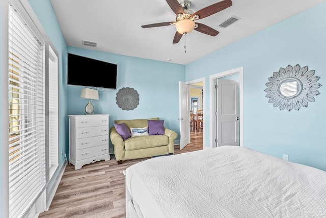 bedroom featuring ceiling fan and light wood-type flooring