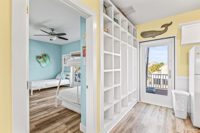 interior space with light hardwood / wood-style floors and ceiling fan