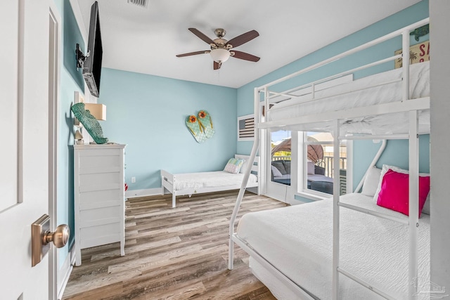 bedroom featuring wood-type flooring and ceiling fan