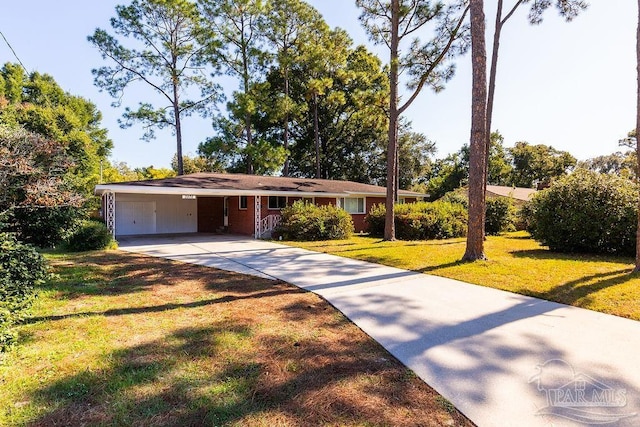 ranch-style home with a carport, a front lawn, and a garage