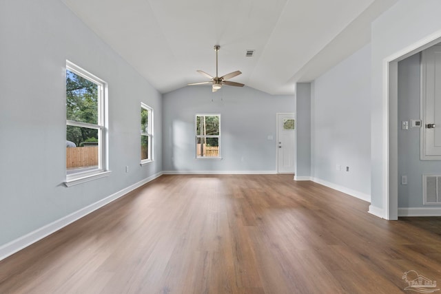 unfurnished living room featuring dark hardwood / wood-style flooring, ceiling fan, and lofted ceiling