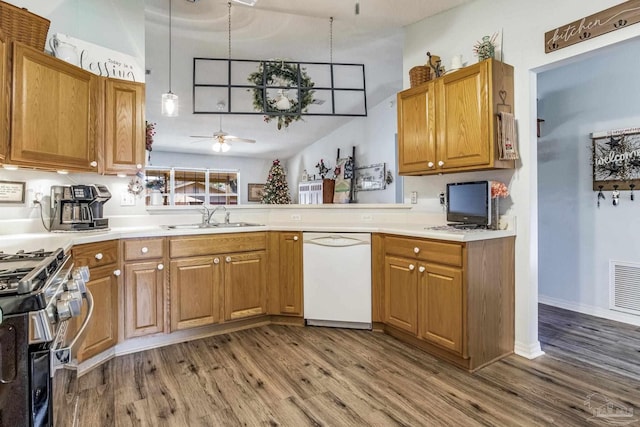 kitchen with pendant lighting, hardwood / wood-style floors, white dishwasher, sink, and ceiling fan