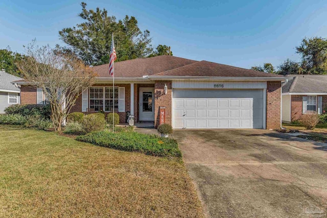 ranch-style home featuring a front lawn and a garage