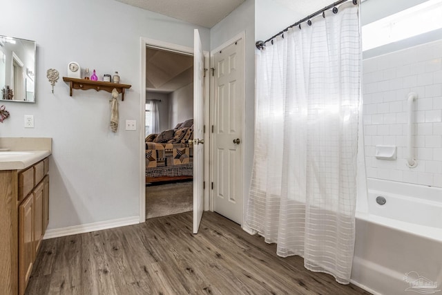 bathroom featuring shower / bath combination with curtain, plenty of natural light, vanity, and hardwood / wood-style floors