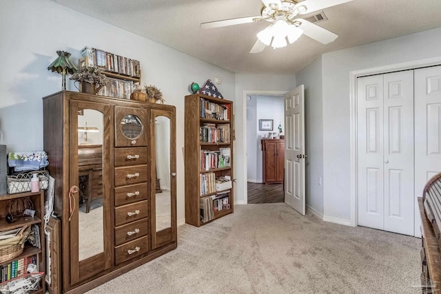 carpeted office with ceiling fan and a textured ceiling