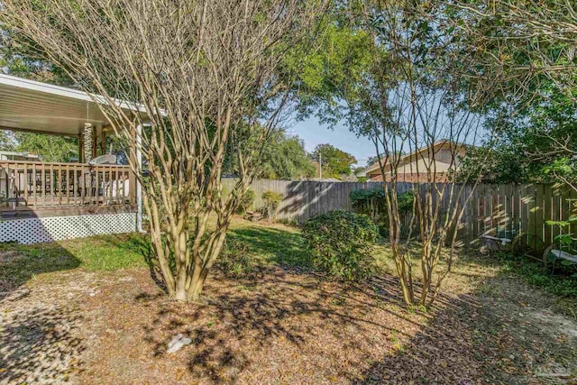 view of yard featuring a wooden deck