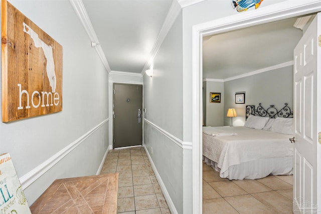 tiled bedroom featuring crown molding