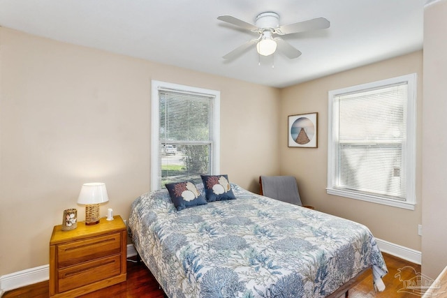 bedroom featuring dark hardwood / wood-style flooring and ceiling fan