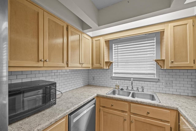 kitchen with a sink, light countertops, black microwave, and stainless steel dishwasher