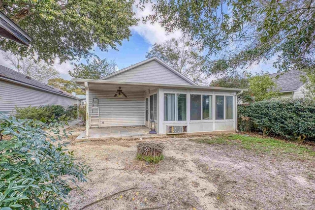 rear view of house with a patio area, ceiling fan, and a sunroom