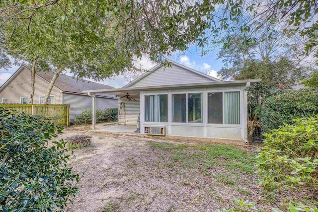 back of house featuring fence, a ceiling fan, and a patio area