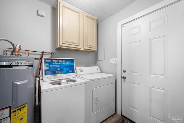 laundry room featuring cabinets, a textured ceiling, electric water heater, and separate washer and dryer