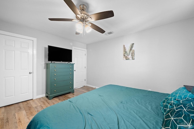 bedroom with hardwood / wood-style flooring and ceiling fan