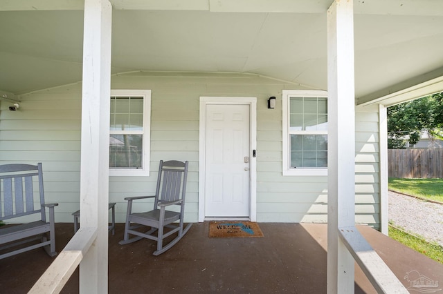 doorway to property featuring covered porch