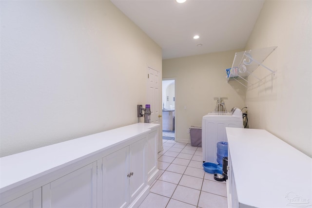 washroom with light tile patterned flooring and washer / dryer