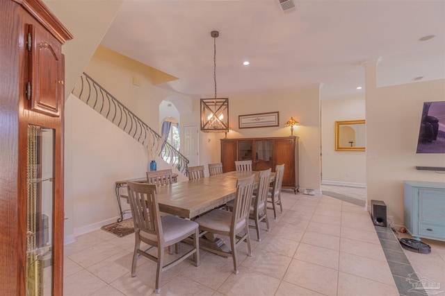 dining area featuring an inviting chandelier and light tile patterned floors