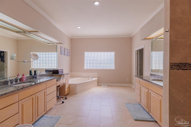 bathroom with plenty of natural light, crown molding, a tub to relax in, and vanity