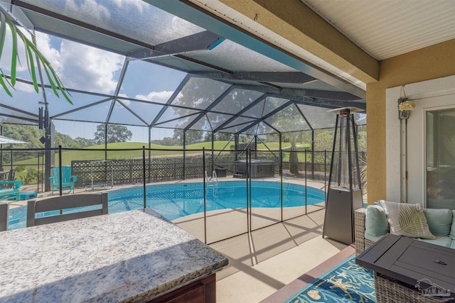 view of pool featuring a lanai and a patio